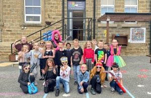 Photo of children dressed up like rock stars