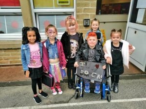Photo of children dressed up like rock stars